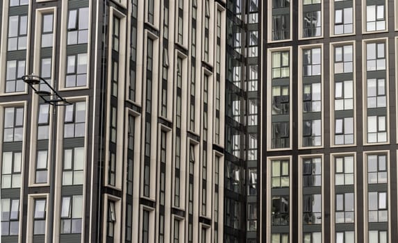 Liverpool, UK - Oct 07, 2023 - The facade of skyscrapers with glass windows. Exterior view of office build containing architecture modern designs, Glass wall of office buildings, Copy space, Selective focus.