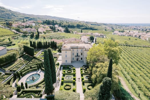Luxurious green garden with fountains near Villa Rizzardi. Valpolicella, Verona, Italy. Drone. High quality photo