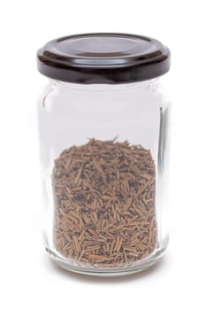 Rosemary Seasoning in a Small Glass Jar Isolated on White Background