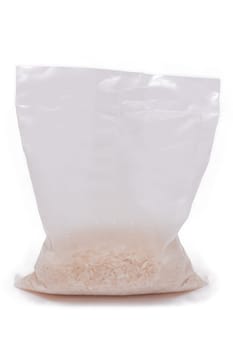 A Plastic Bag of White Long Grain Rice - Isolated on White Background. Small Transparent Package with Dry Rice - Isolation