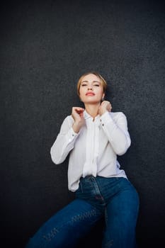 Portrait of a beautiful slender fashionable young woman outdoors