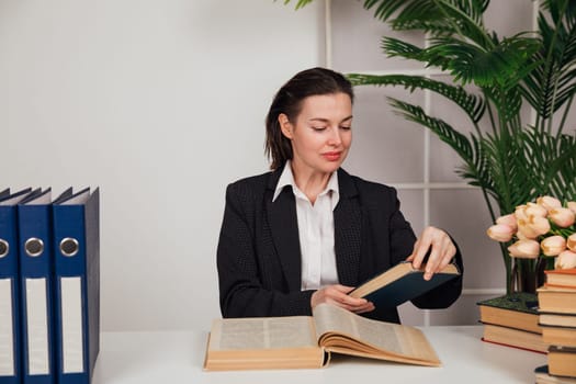 woman in suit at desk in office