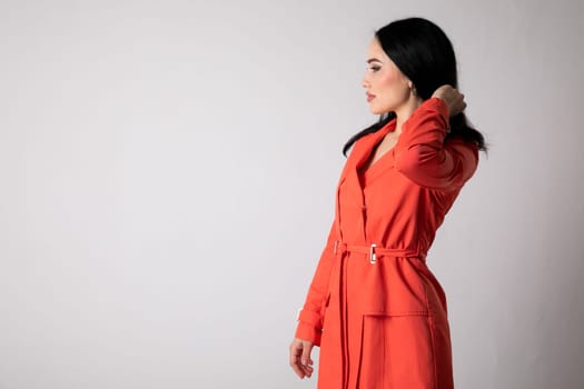 Portrait of a beautiful young woman in red clothes