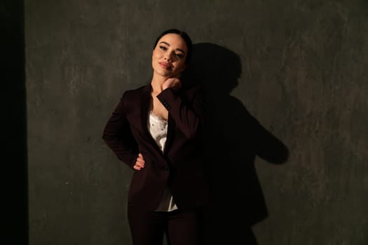 Business woman in brown business suit in office