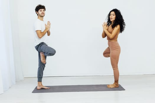 Man And Woman Doing Couple Yoga Fitness Gymnastics