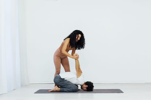 Man And Woman Doing Couple Yoga Fitness Gymnastics