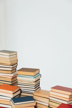 Lots of stacks of old books on white background university school library