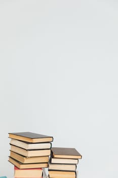 Lots of stacks of old books on white background university school library