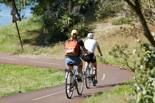 Person riding a bicycle on a cycle path a sunny day