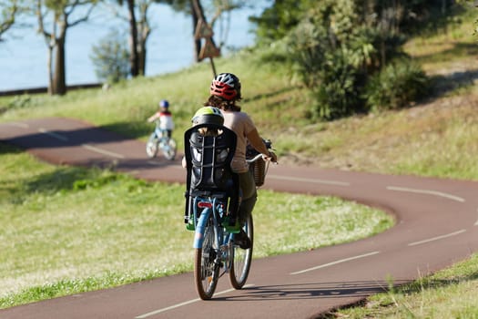 Person riding a bicycle on a cycle path a sunny day