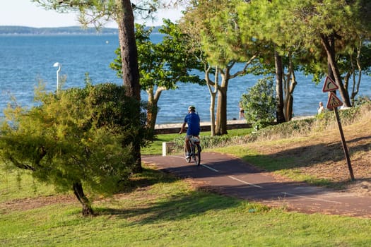 Person riding a bicycle on a cycle path a sunny day