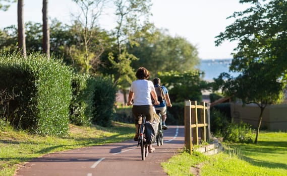 Person riding a bicycle on a cycle path a sunny day