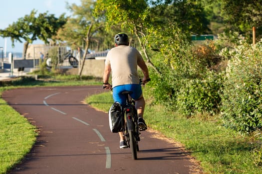 Person riding a bicycle on a cycle path a sunny day