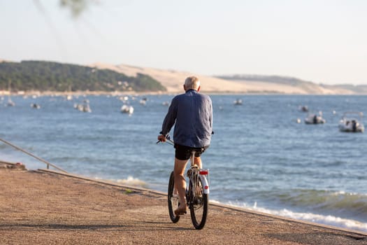 Person riding a bicycle on a cycle path a sunny day