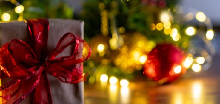 Christmas gift or present box, against magic bokeh background. Beautiful Christmas gift boxes with ribbon.