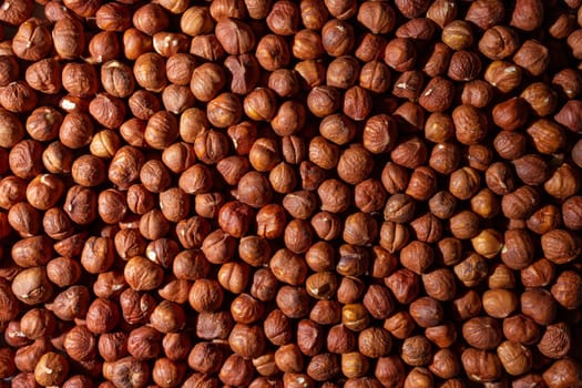 Scattered Peeled Hazelnut - Top View. Background from Hazelnuts. Natural High-Calorie Snacks