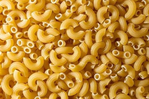 Uncooked Chifferi Rigati Pasta: A Culinary Canvas of Chifferi Rigati, Creating a Lively and Textured Background for Gourmet Cooking. Dry Pasta. Raw Macaroni - Top View, Flat Lay