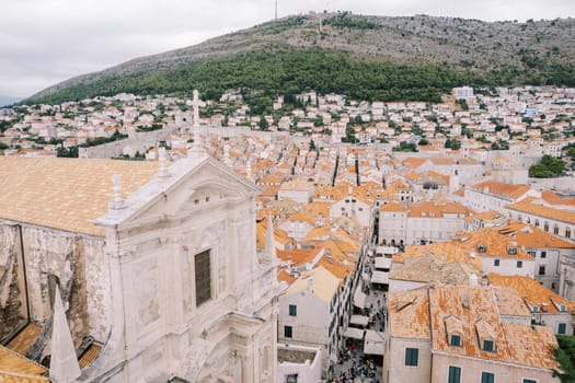 Cross on the red tiled roof of the Cathedral of St. Ignatius. Dubrovnik, Croatia. Drone. High quality photo