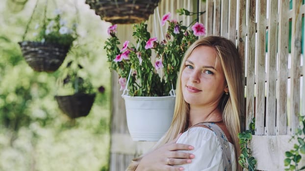 German girl posing outside the house