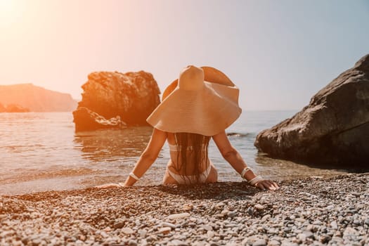 Woman travel sea. Happy tourist taking picture outdoors for memories. Woman traveler looks at the edge of the cliff on the sea bay of mountains, sharing travel adventure journey.