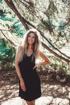 Beautiful woman in black summer dress