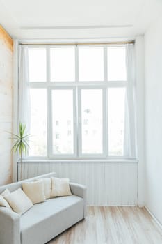 Interior of a white room with a large window