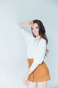 brunette posing in bright studio room