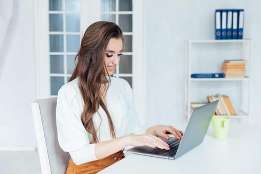 brunette with laptop communication online remote work