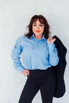 woman with jacket on light background