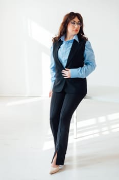 Woman at the white table in the classroom office