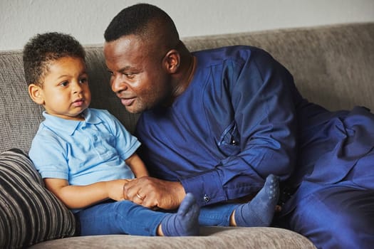 Tilst, Denmark, 12th of August: Father playing with son at home.