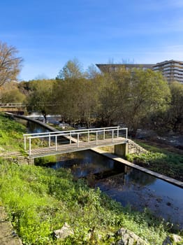 Hiker's point of view along the Corgo river city park in Vila Real, Portugal.