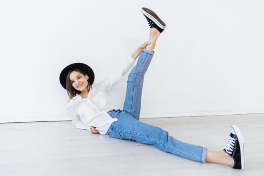 Woman in hat posing in studio