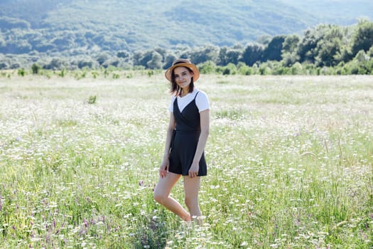 woman in field in flowers in nature walk chamomile journey