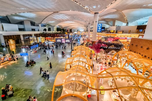 Istanbul, Turkey, November 25 2023: New Istanbul airport (IST) large shopping and departure area view. One of the largest and busiest airports of the World.