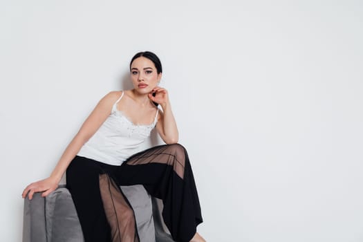 fashionable woman posing in studio