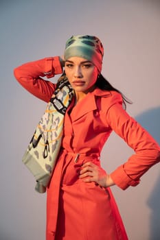 Fashionable woman in headscarf posing