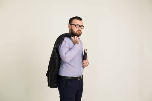 Portrait of a man in business attire with a book 1