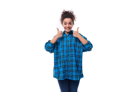 portrait of a young pretty woman with curled hair smiling on a white background.