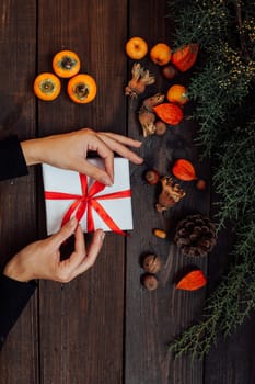 gift in hand Christmas tree in white background winter new year