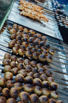 kebabs and vegetables cooked on grill