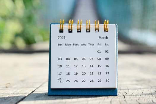 March 2024 white calendar with green blurred background. 2024 new year concept.