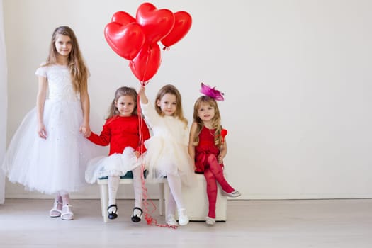 girls in red and white clothes on birthday party