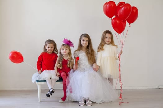 girls in red and white clothes on birthday party