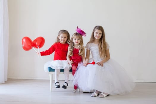 girls in red and white clothes on birthday party