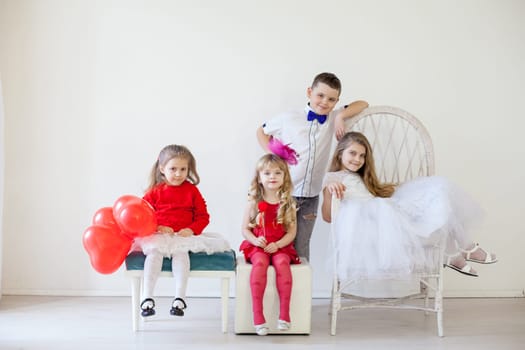 Girls and boy on holiday with balloons