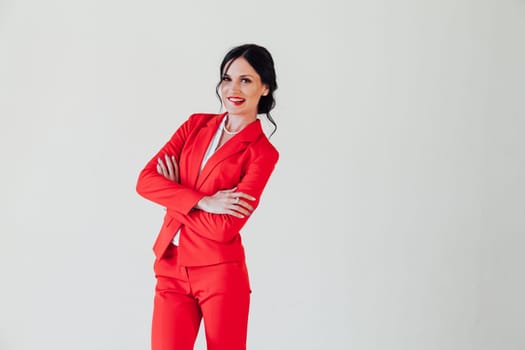 Portrait of a beautiful woman in a red business suit in the office