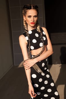 Beautiful woman braids in polka dot dress