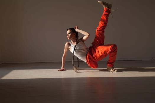 woman braids dancing alone to music