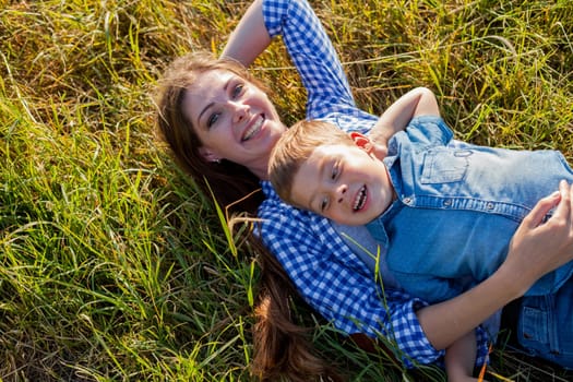 Portrait of a woman with her son on a walk in nature